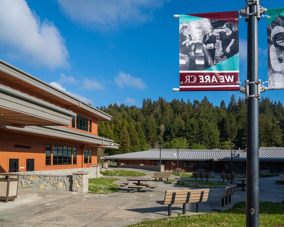 campus building with We Are CR flag pole sign